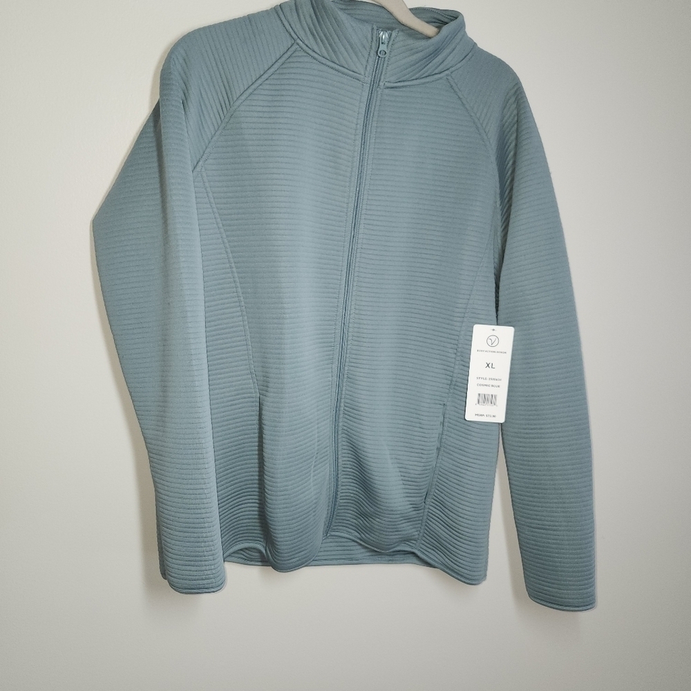 NWT Women Blue lightweight spandex jacket.